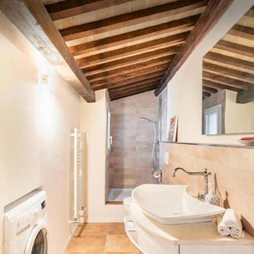 Bathroom beneath exposed timber beams